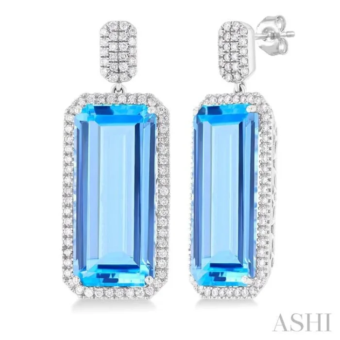 22×10 MM Emerald Cut Blue Topaz and 7/8 Ctw Round Cut Diamond Halo Semi-Precious Earrings in 14K White Gold