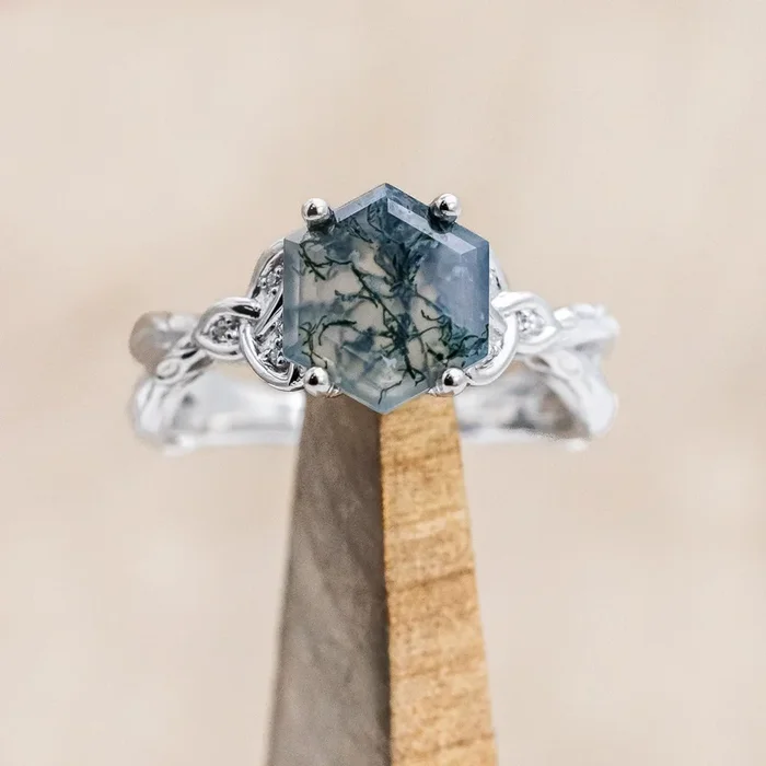 “AMARIS” – CELTIC KNOT ACCENTED HEXAGON CUT MOSS AGATE ENGAGEMENT RING WITH DIAMOND ACCENTS