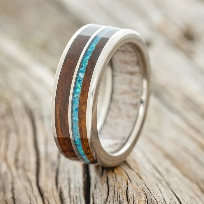 “DYAD” – KOA WOOD & BLUE OPAL WEDDING RING FEATURING AN ANTLER LINED BAND