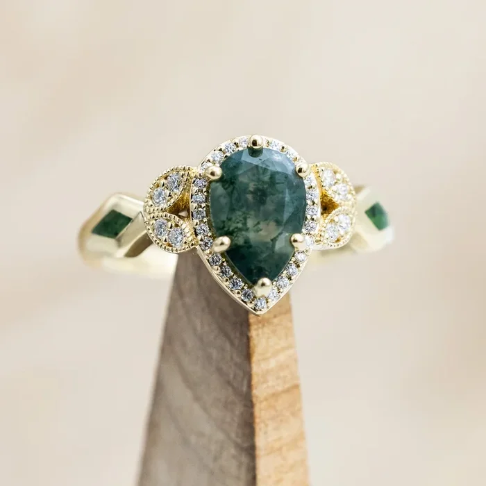 “LUCY IN THE SKY” – PEAR CUT MOSS AGATE ENGAGEMENT RING WITH DIAMOND HALO & MOSS INLAYS