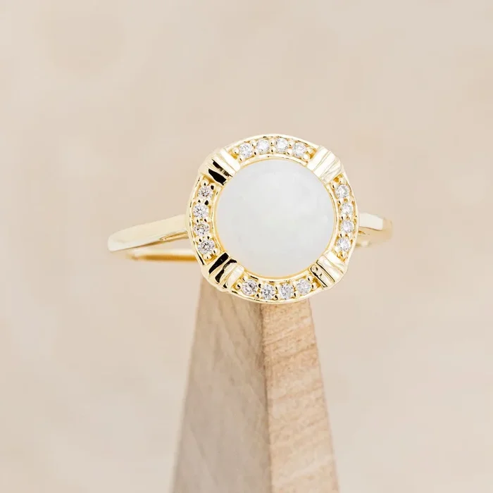 “PETRA” – ROUND CABOCHON CUT WHITE OPAL ENGAGEMENT RING WITH DIAMOND HALO