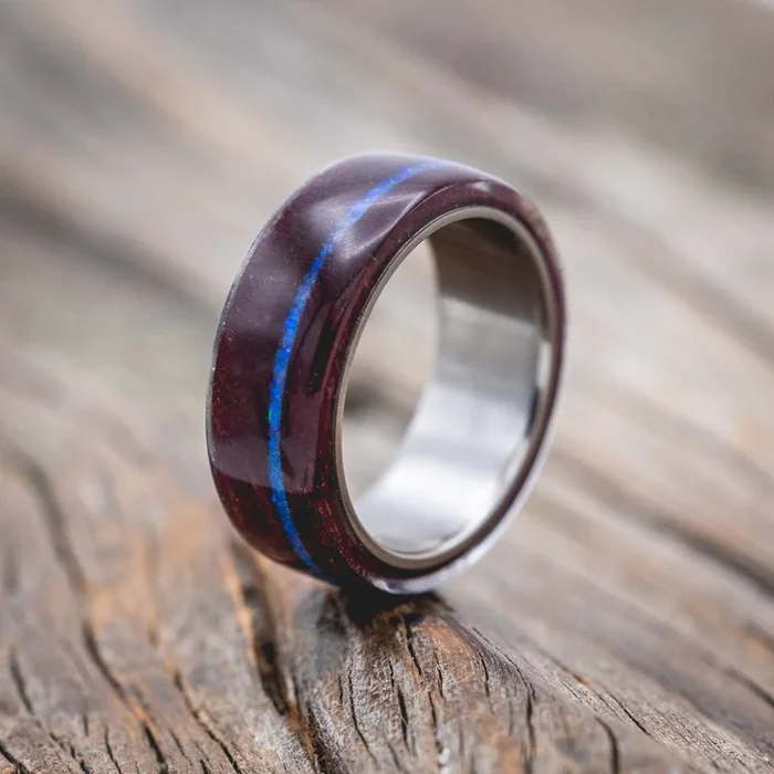 “REMMY” – PURPLE HEART WOOD WEDDING BAND WITH A BLUE OPAL INLAY
