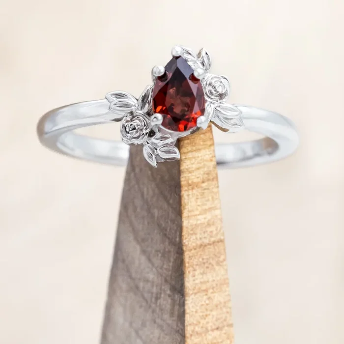 “ROSA” PETITE – PEAR CUT MOZAMBIQUE GARNET ENGAGEMENT RING WITH FLOWER ACCENTS – 14K WHITE GOLD – SIZE 7