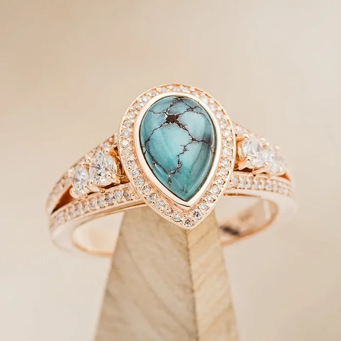 “SOFIA” – PEAR CABOCHON CUT TURQUOISE ENGAGEMENT RING WITH DIAMOND HALO & ACCENTS