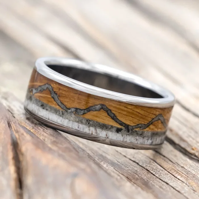 “THE EXPEDITION” – MOUNTAIN ENGRAVED WEDDING RING WITH WHISKEY BARREL OAK, MOONSTONE & ANTLER
