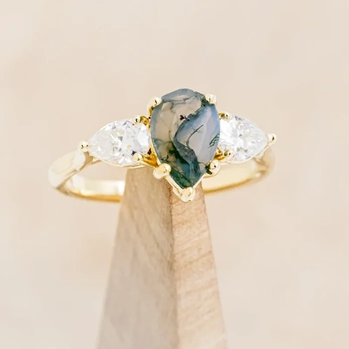 “VOGUE” – PEAR CUT MOSS AGATE ENGAGEMENT RING WITH MOISSANITE ACCENTS