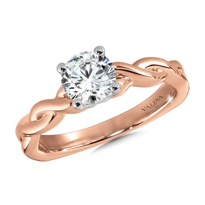 Polished twist engagement ring in 14k rose gold, including two hidden accent diamonds under the center stone.